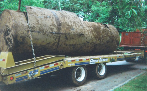 2000 gallon underground tank on trailer that has been properly cut, cleaned and ready for disposal