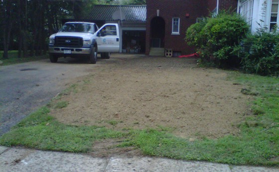 Regraded work area with truck in background