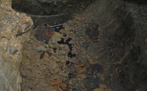 Oil spill tank grave