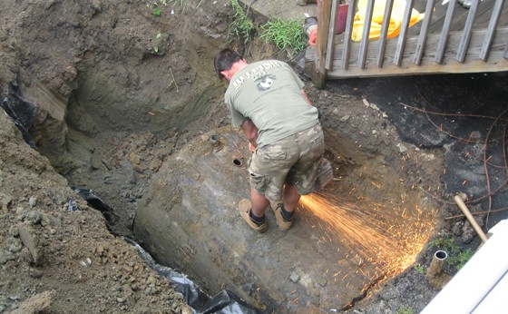 Cutting a hole in top of tank so it can be properly cleaned out