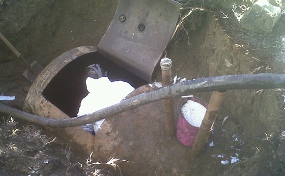 HAZ-MAT tech inside the tank so it is fully cleaned and ready to be removed from the ground