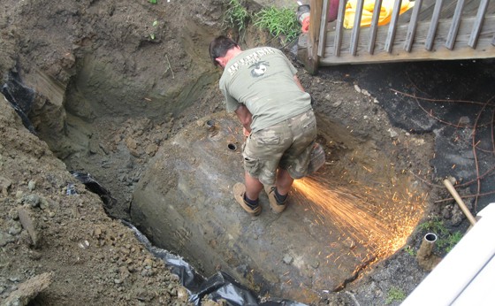 Cutting a hole in top of tank so it can be properly cleaned out