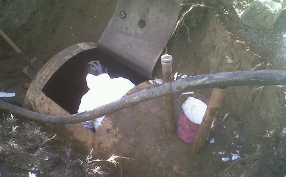 HAZ-MAT tech inside the tank so it is fully cleaned and ready to be removed from the ground