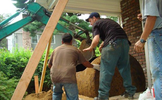 VERY CAREFUL Removal of a 550 gallon from under a front porch